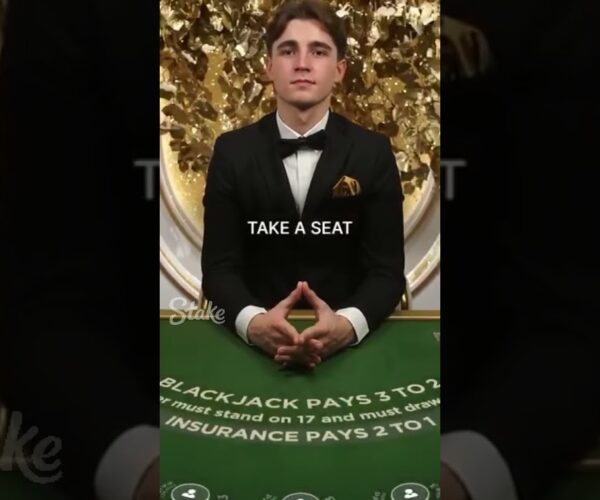 Young handsome man wins big at blackjack on YouTube shorts. Big Win!